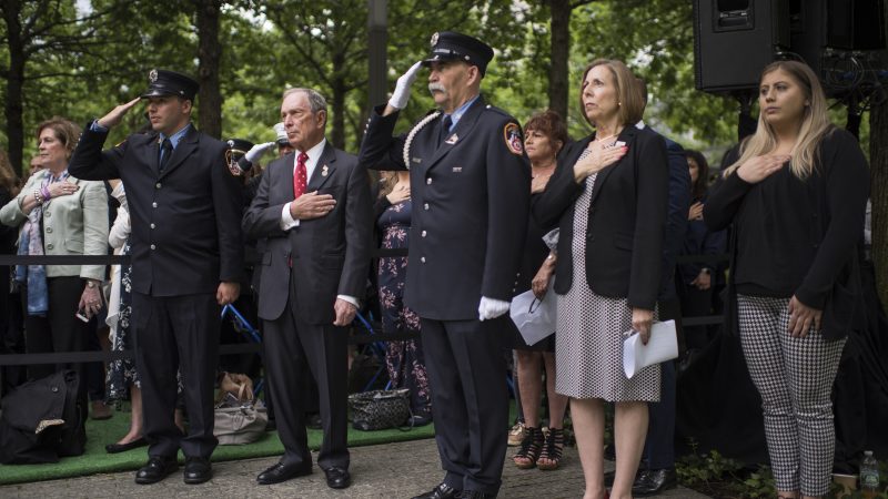 Mike Bloomberg and Alice Greenwald with members of New York City Fire Department at the 9/11 Memorial Glade dedication ceremony in May, 2019.