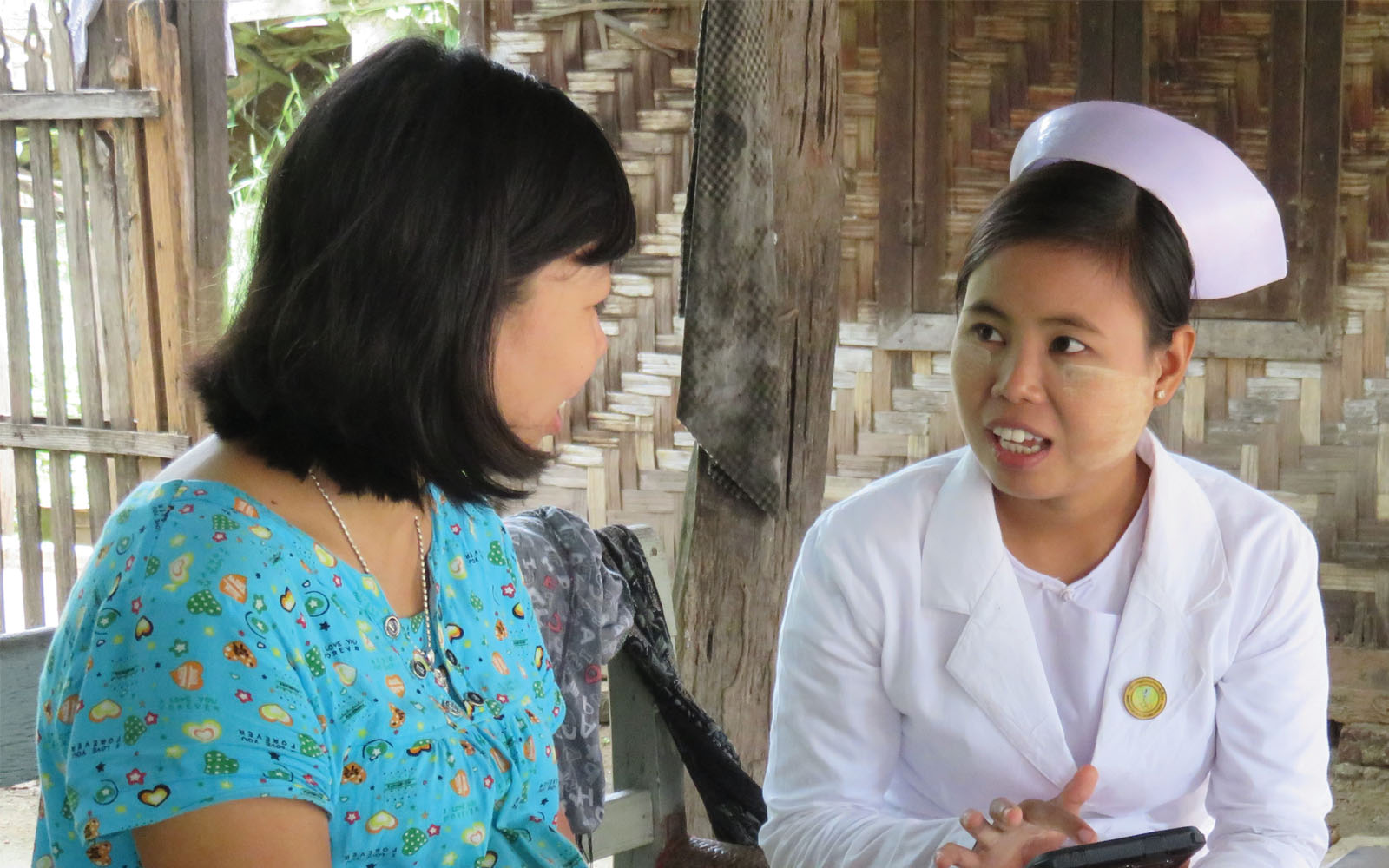A medical worker in Myanmar collects health information.
