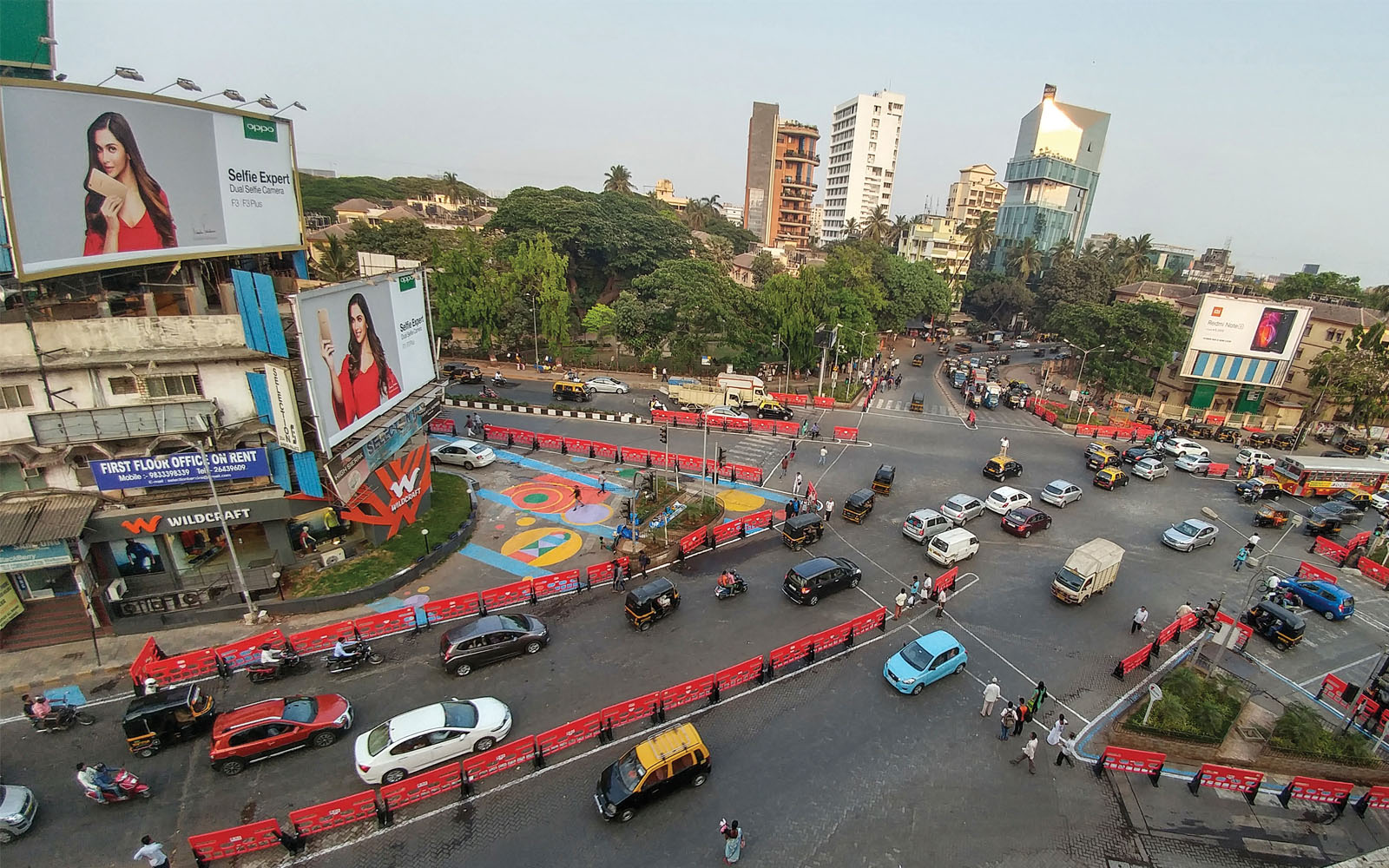 A busy intersection in Mumbai, India, was redesigned with colorful barriers and crosswalks, making pedestrians, cyclists, and drivers safer.