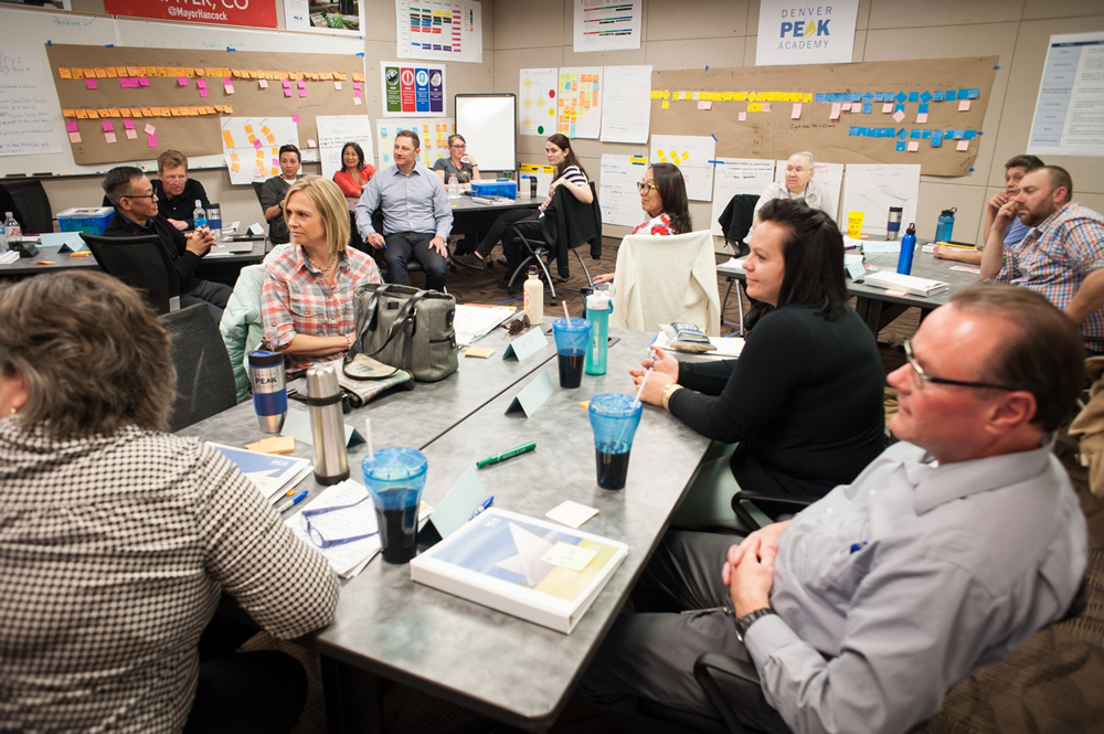 Photo of city employees participating in a Denver Peak Academy learning session