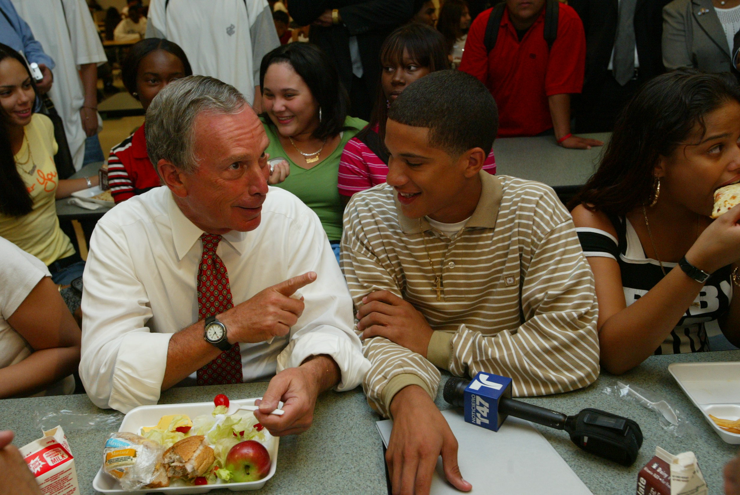 Mike grabs lunch with students during a visit to Queens Vocational & Technical High School